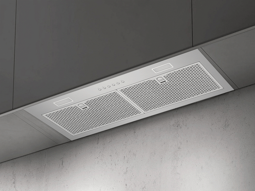 A modern kitchen featuring the VICTORY Q1 range hood insert installed flush inside a dark grey cabinet for a seamless look